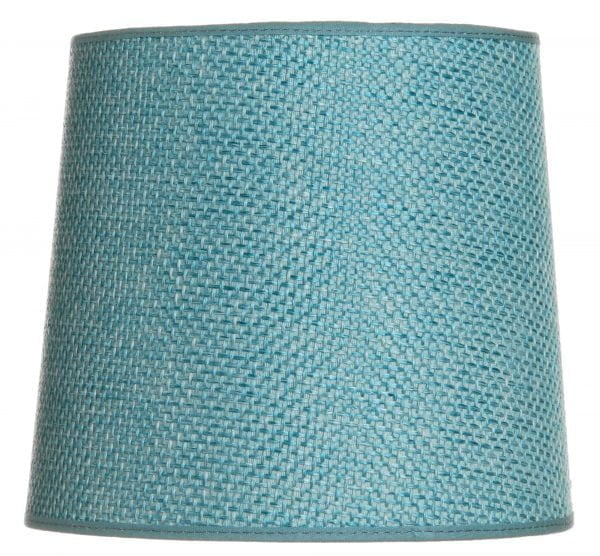Yksivärinen lampunvarjostin jonka väri on turkoosi. Varjostin on materiaaliltaan laminoitua kangasta.
