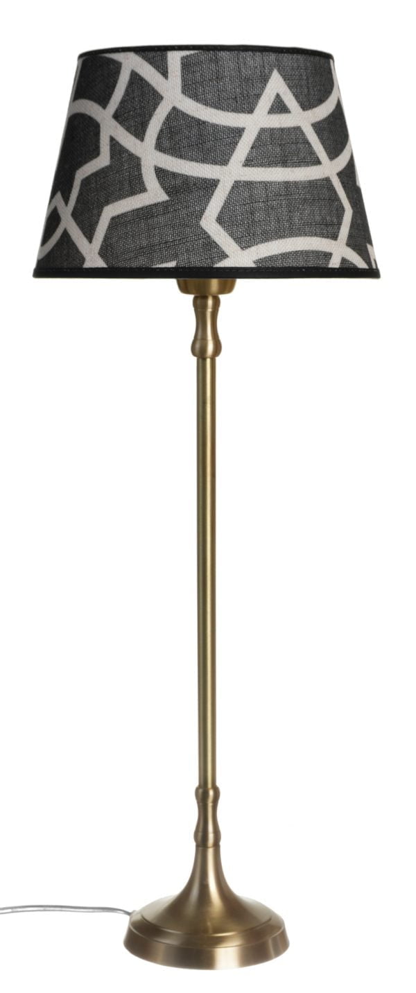 Metallinen lampunjalka jonka väri on antiikki messinki Varjostimessa on graafinen kuvio.