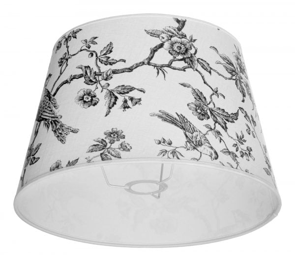 Lampunvarjostin jossa on valkoisella pohjalla musta lintu ja kukka kuvio. Varjostin on materiaaliltaan laminoitua kangasta.