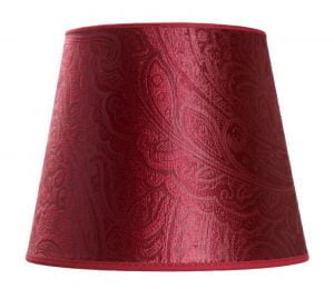 Kuvioitu lampunvarjostin jonka väri on punainen. Varjostin on materiaaliltaan laminoitua kangasta.