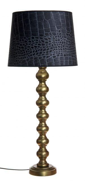 Metallinen lampunjalka jonka väri on antiikki messinki. Varjostimessa on krokotiilinnahkakuosi.